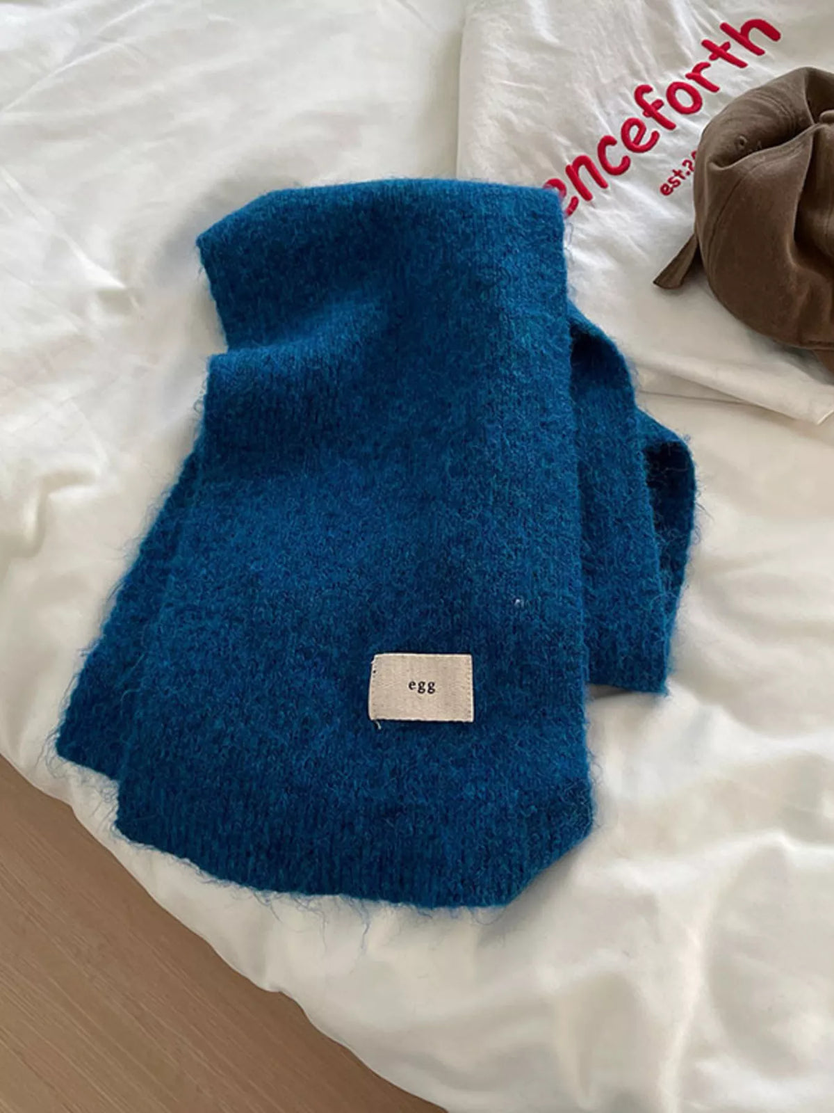 Unisex Fuzzy Solid Knit Scarf — folded peacock blue scarf showing its fuzzy-looking surface