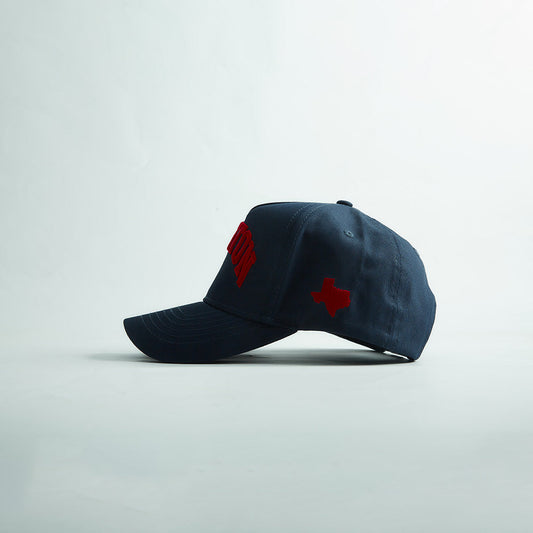 Side profile of the Destination Hat Co. Houston Legacy snapback showing the curved bill and side logo