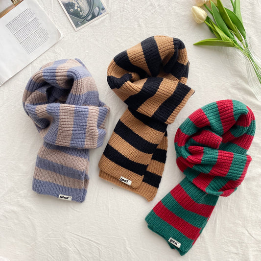 Three striped winter scarves in muted blue camel black and red green