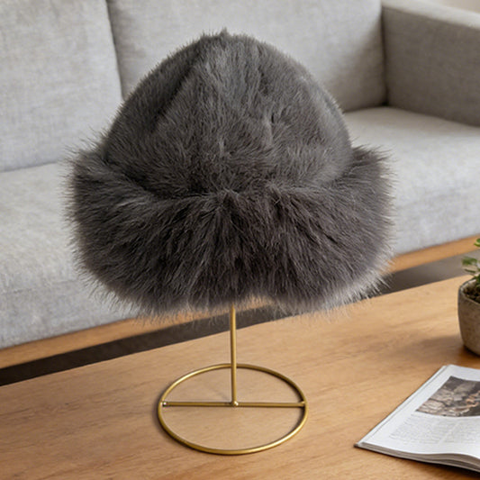 Dark gray plush winter cloche displayed on a hat stand