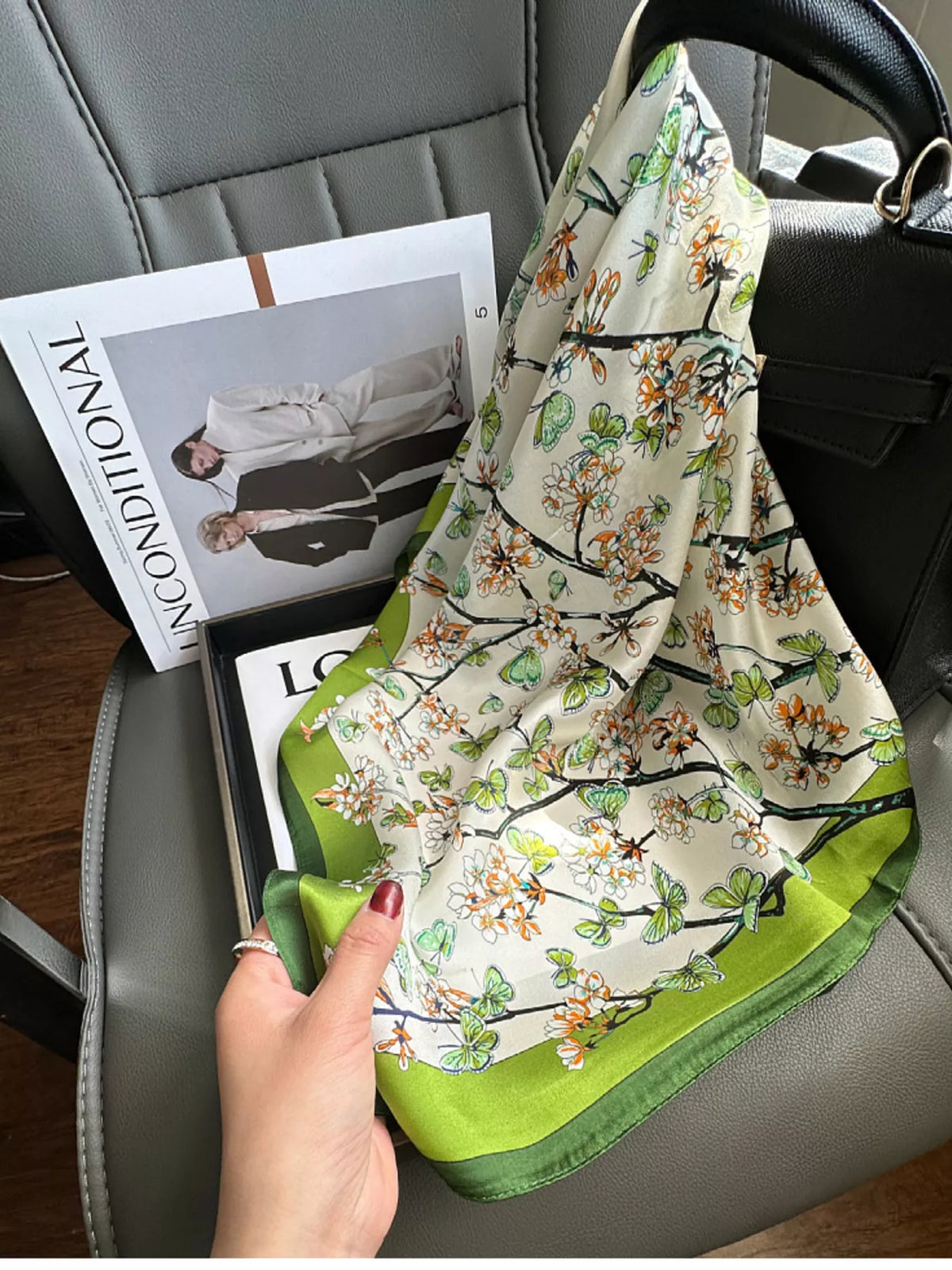 Unisex Floral Print Silk Scarf — floral silk scarf draped with a green corner visible