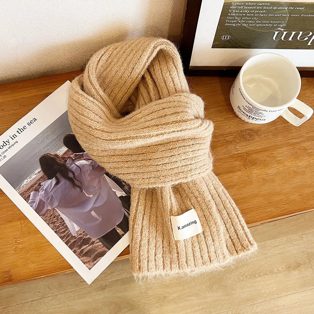 Unisex Soft Ribbed Wool Scarf — khaki ribbed wool scarf looped on a wooden surface