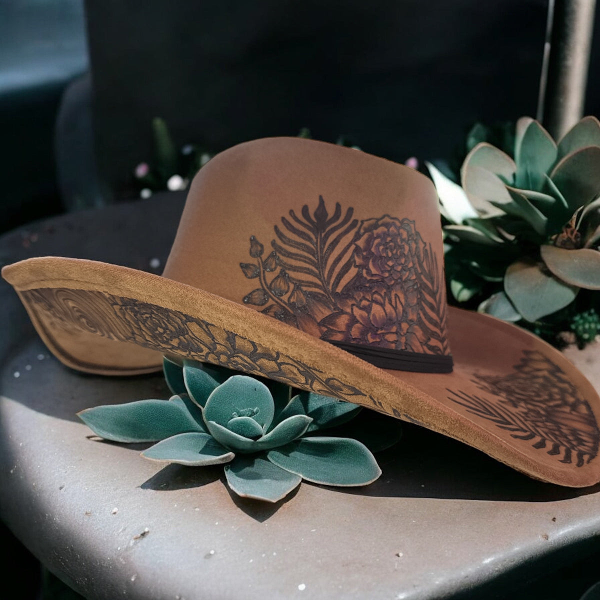 Side view of the Piper Jade cowboy hat showing its sweeping brim and decorative band