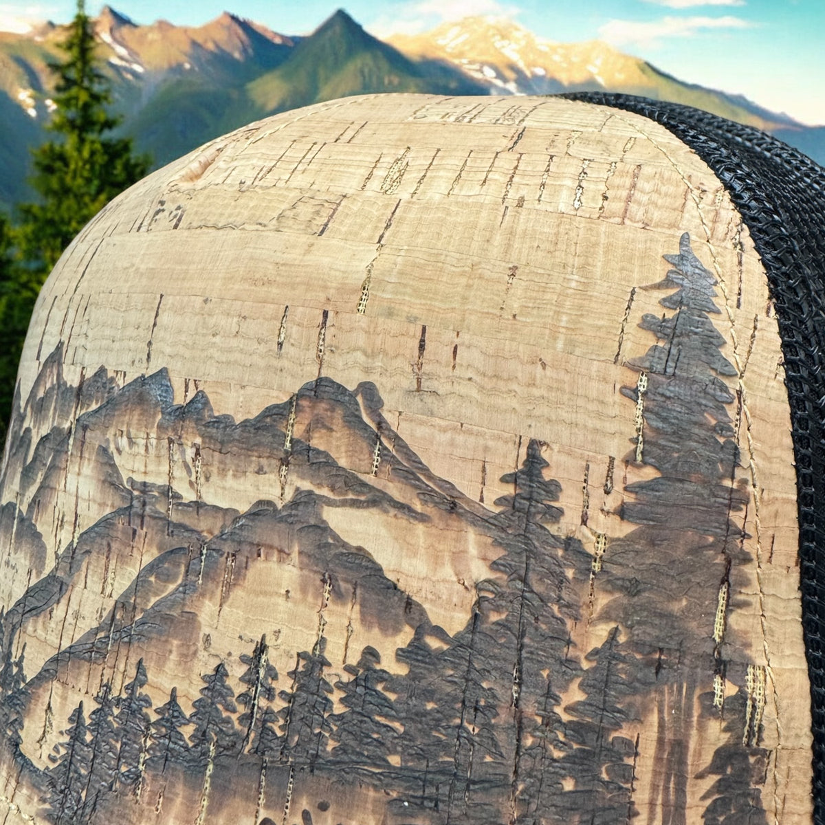 Close-up of the Grand Tetons mountain peaks and evergreen artwork burned into cork