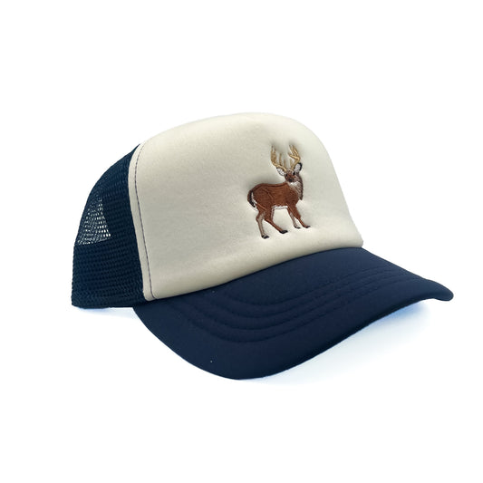Angled view of Rey To Z Buck Trucker Hat in Navy/White showing the curved bill and mesh panels