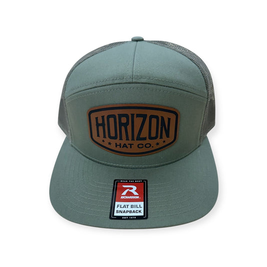 Loden Horizon flat-bill cap with a rawhide-colored patch