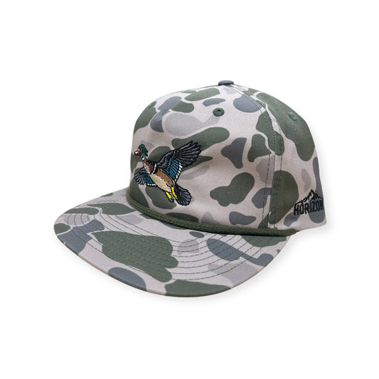 Angled view of the Marsh Duck Camo Wood Duck cap with a black rope and flat bill