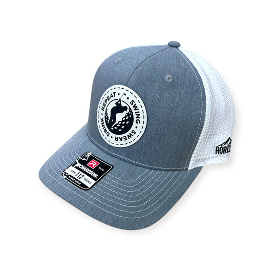 Angled view of Swing, Swear, Drink, Repeat patch hat by Horizon Hat Co. in heather gray/white showing the curved bill and side panels