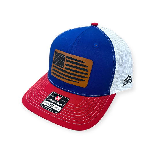 Angled view of American Flag patch hat by Horizon Hat Co. in royal/white/red showing the bill and side panels