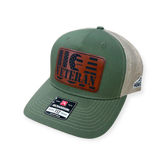 Angled view of Veteran US Flag patch hat by Horizon Hat Co. in army olive/tan showing the curved bill and side panels