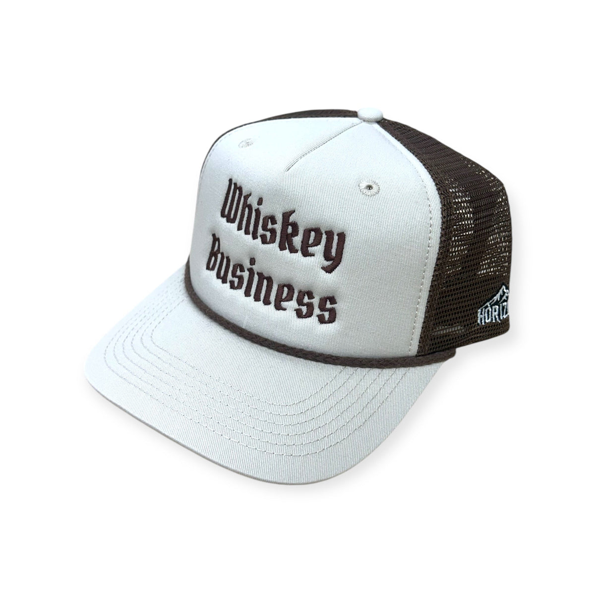 Angled view of Whiskey Business embroidered cap by Horizon Hat Co. in sand/chocolate showing the bill and side panels