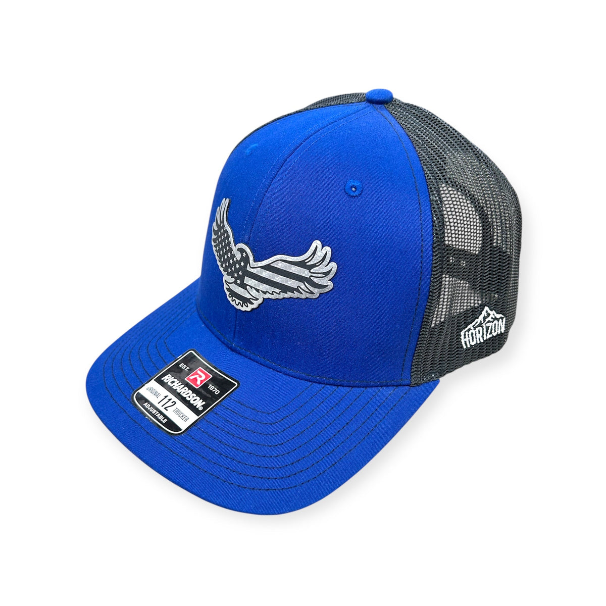 Angled view of Eagle Flag patch hat by Horizon Hat Co. in royal/black showing the bill and side panels
