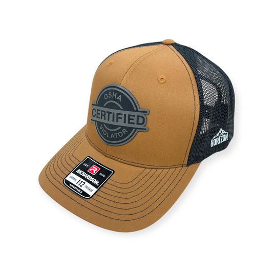 Angled view of Osha Violator patch hat by Horizon Hat Co. in caramel/black showing the curved bill and side panels