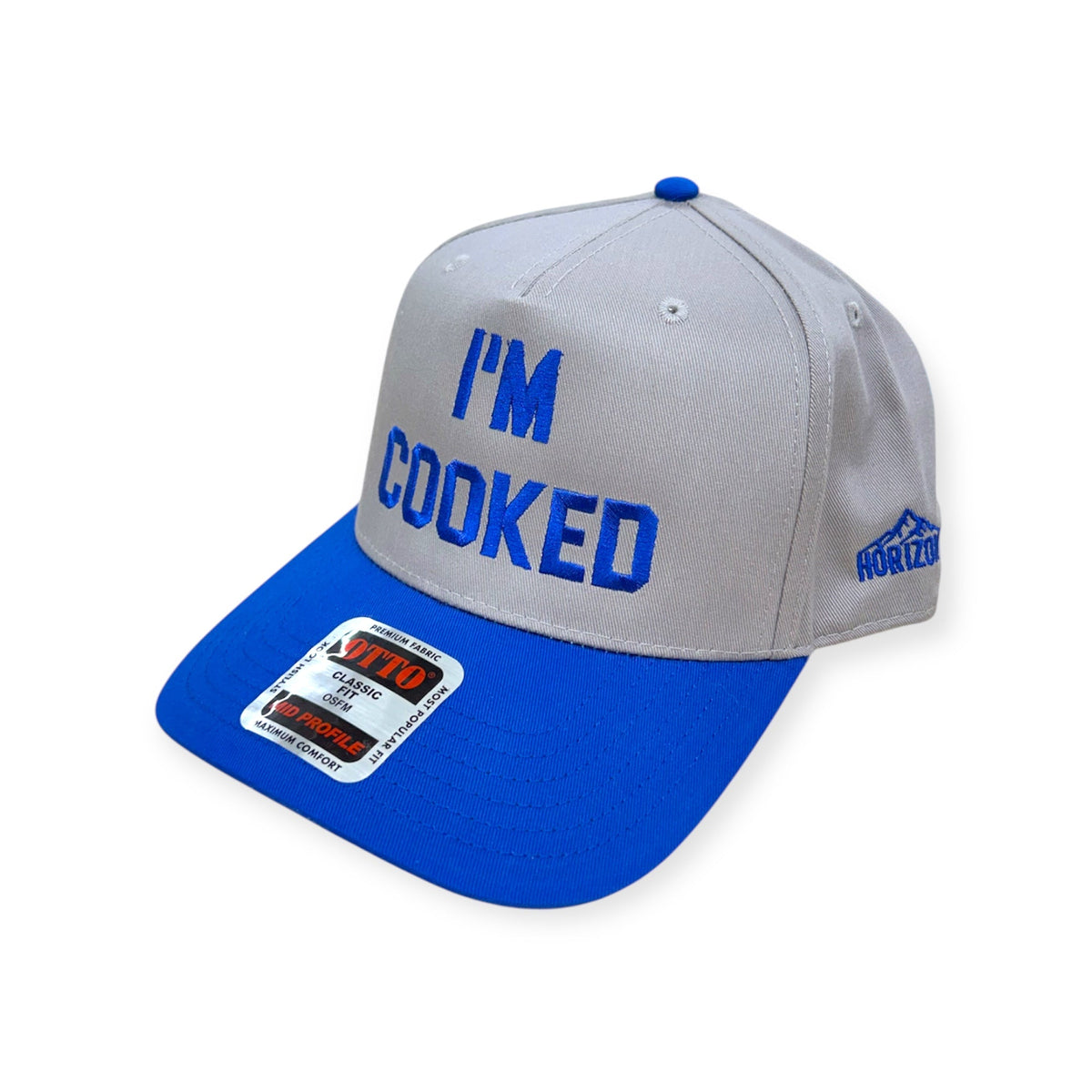 Angled view of I'm Cooked embroidered cap by Horizon Hat Co. in gray/blue showing the bill and side panels