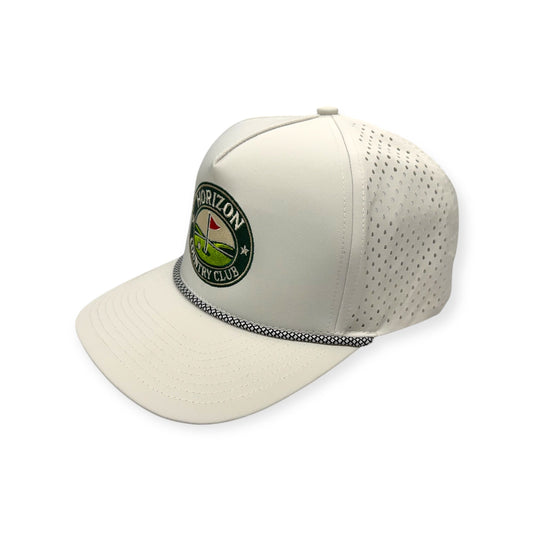 Angled view of Horizon Country Club patch hat by Horizon Hat Co. in off white showing the perforated side panels