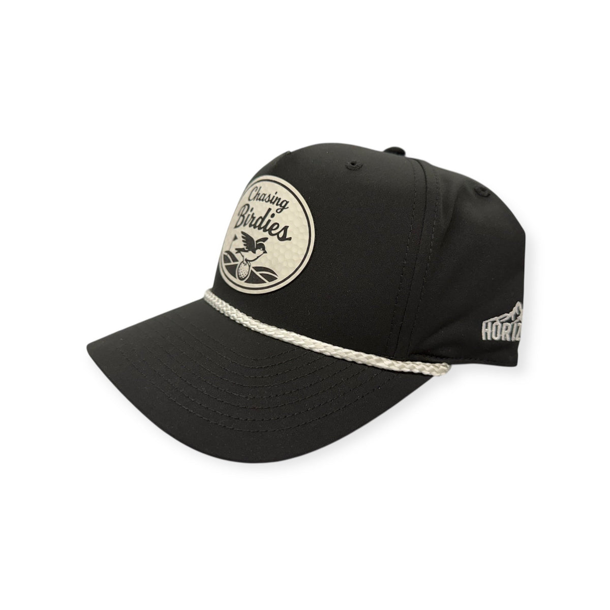 Angled view of Chasing Birdies patch hat by Horizon Hat Co. in black/white showing the rope detail and curved bill