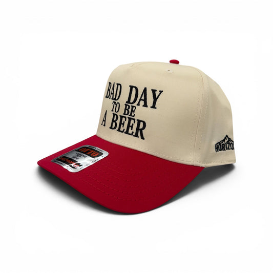 Angled view of the red-bill Bad Day to Be a Beer cap