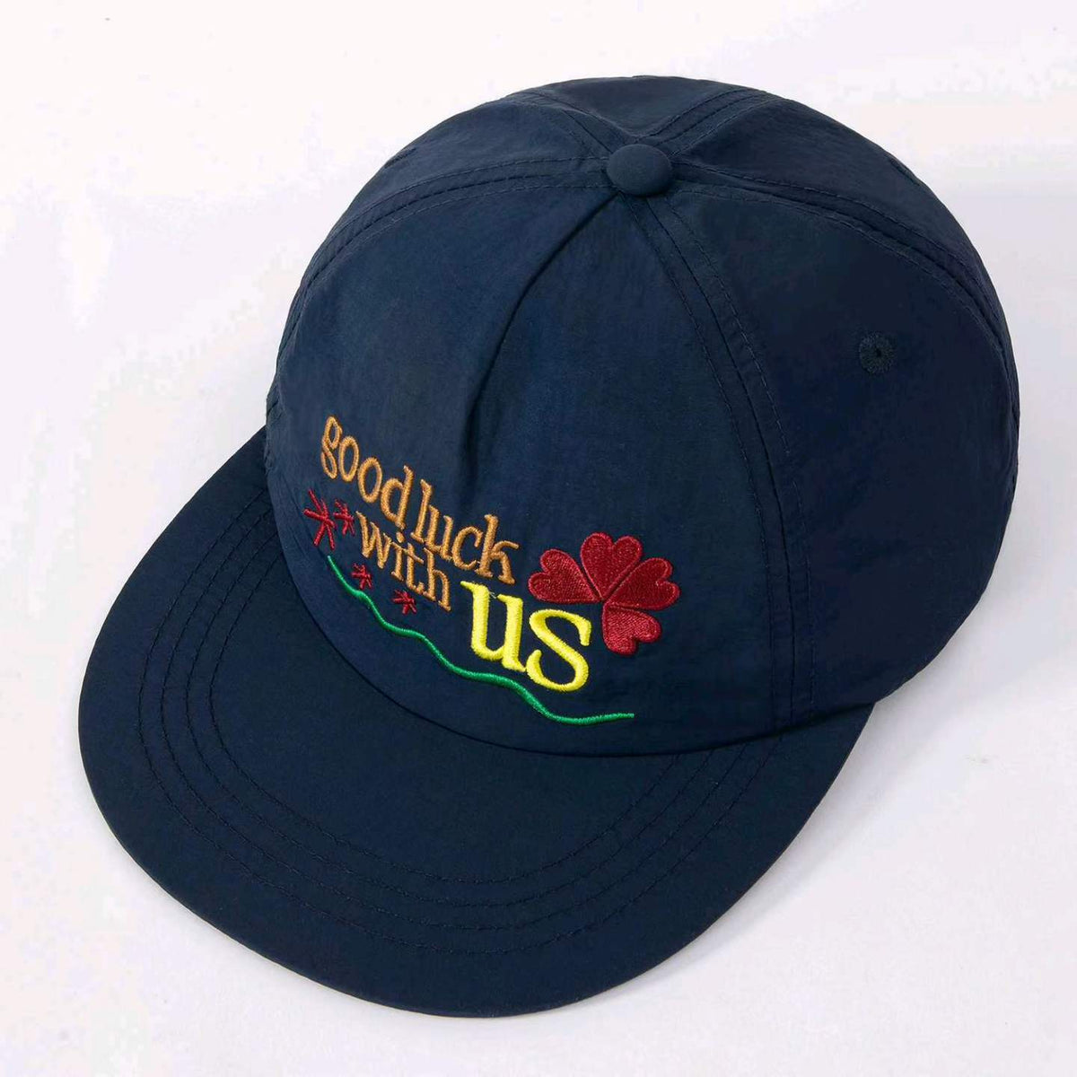 Blue lucky clover baseball cap shown from a three-quarter angle