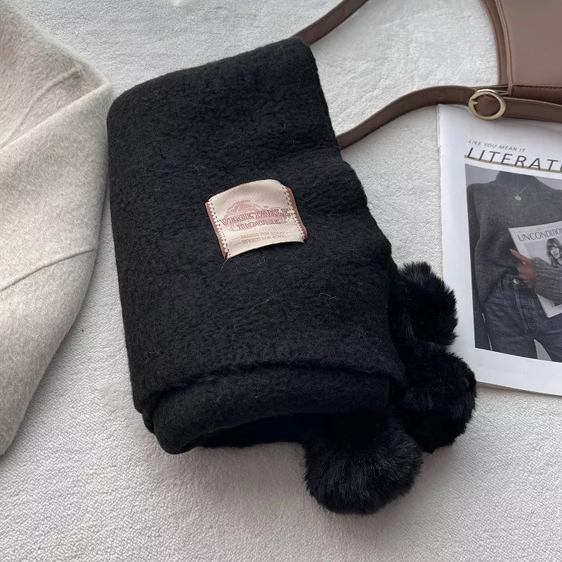 Unisex Pom-Pom Tassel Warm Scarf — black scarf with matching pom-poms beside a hanger