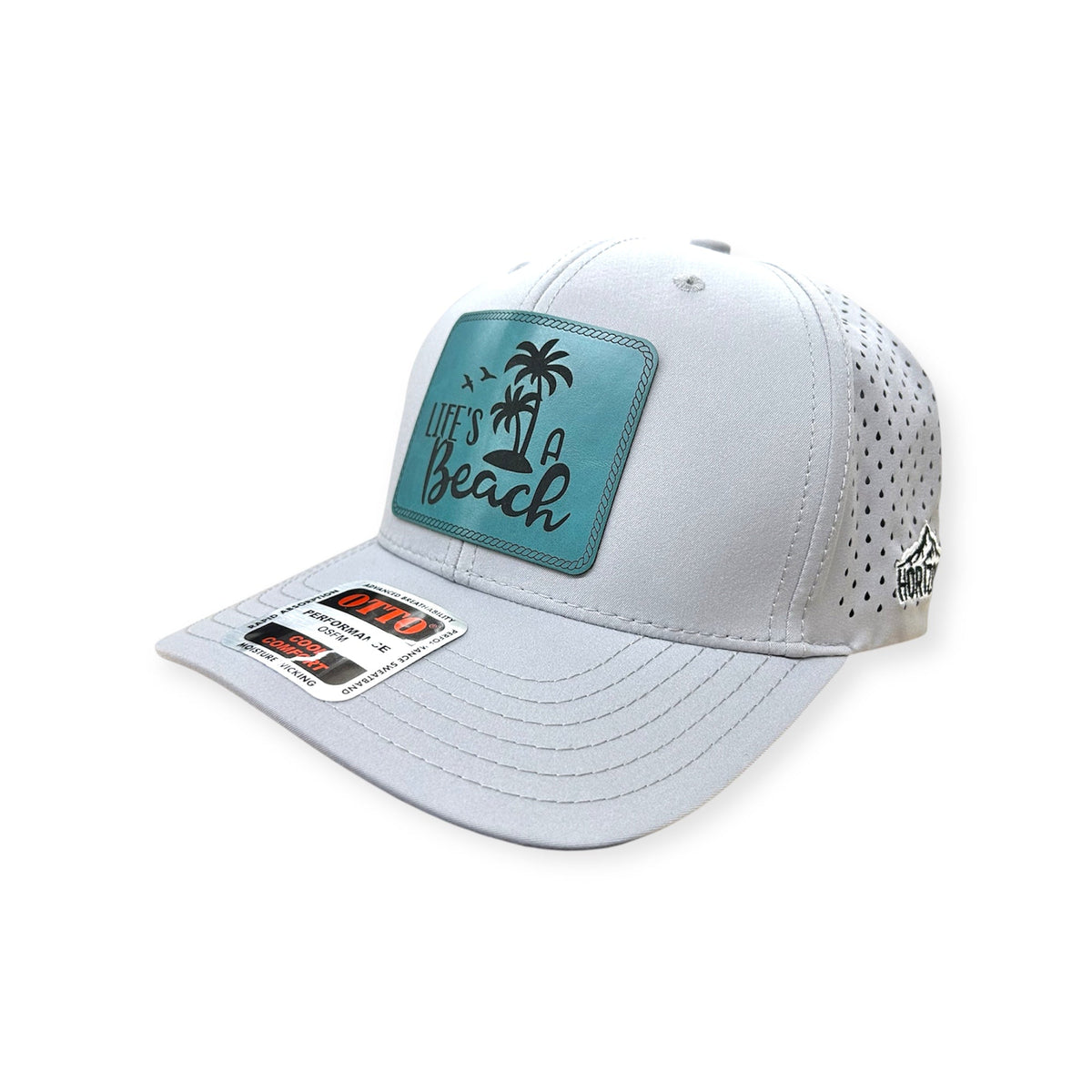 Angled view of Life's A Beach patch hat by Horizon Hat Co. in white showing the bill and side panels
