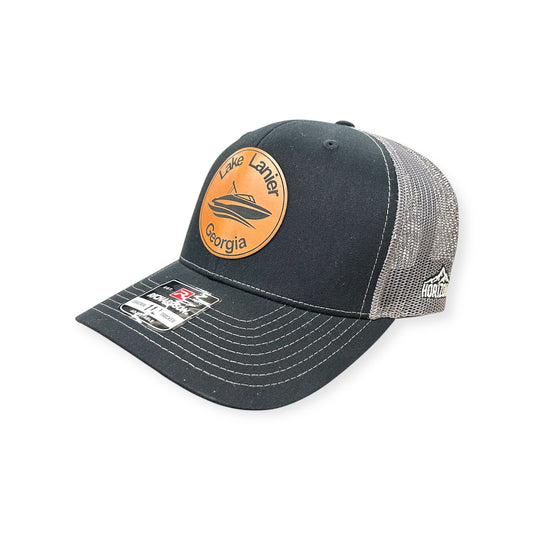Angled view of Lake Lanier patch hat by Horizon Hat Co. in black/charcoal showing the curved bill and side panels