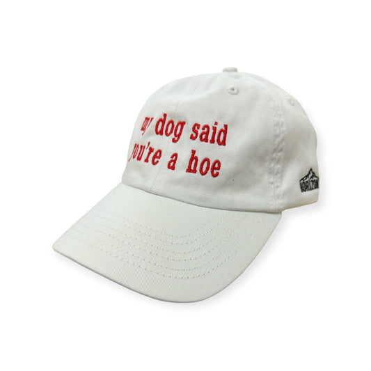 Angled view of My Dog Said You're a Hoe embroidered cap by Horizon Hat Co. in white showing the bill and side panels