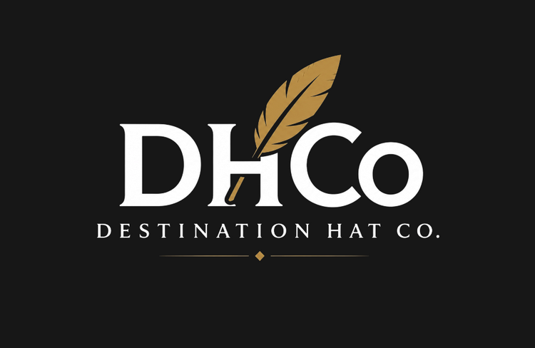 Destination Hat Co. white DHCo wordmark and gold feather on a dark background