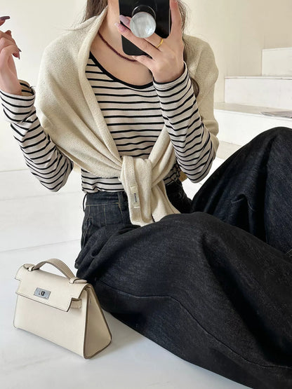Women's Neutral Wool Shoulder Wrap — pale shoulder wrap tied over striped knitwear