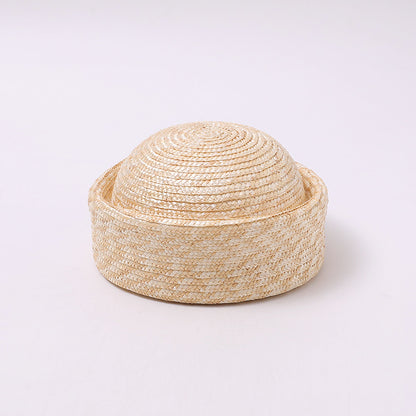 Natural straw brimless hat styled for summer