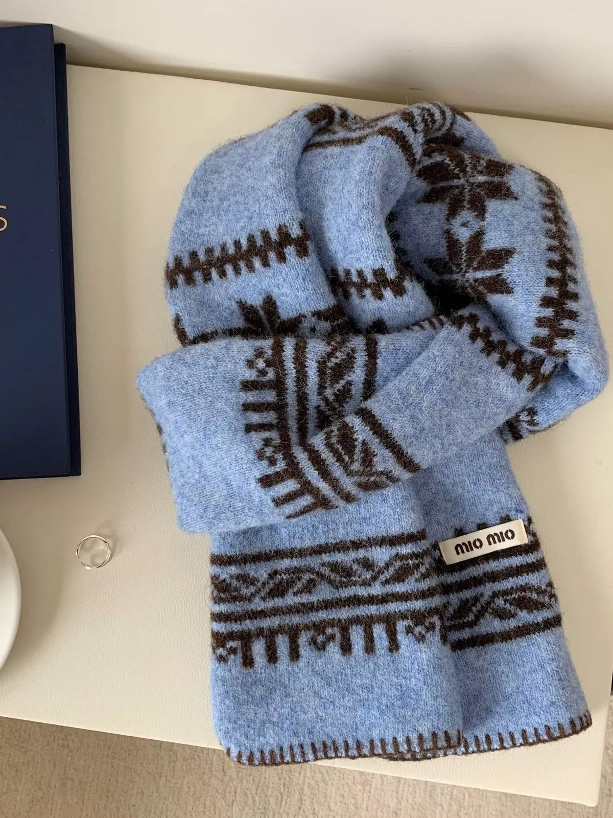 Unisex Vintage Pattern Knitted Scarf — light blue vintage motif scarf loosely knotted