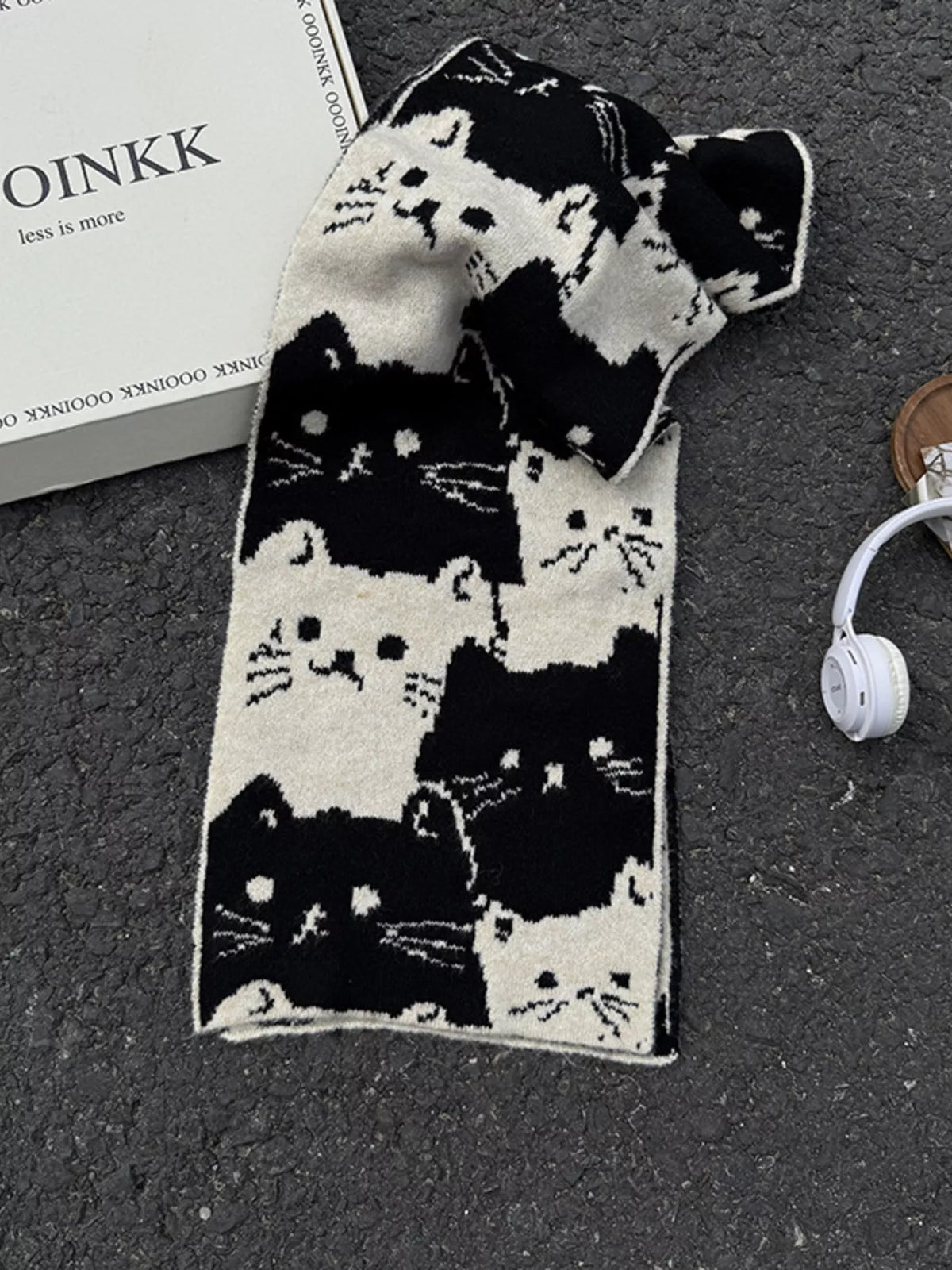 Unisex Allover Cat Knit Scarf — black scarf with pale cats loosely tied