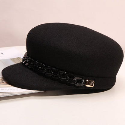 Women's chain detail cap styled for winter