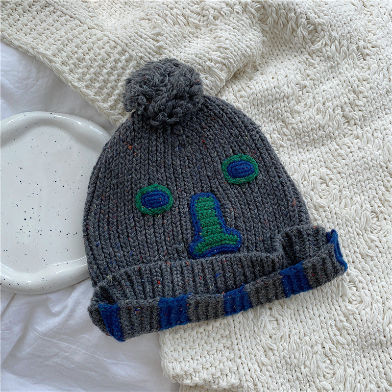 Unisex Cartoon Embroidered Pom Pom Knit Beanie — gray beanie with embroidered face and striped cuff