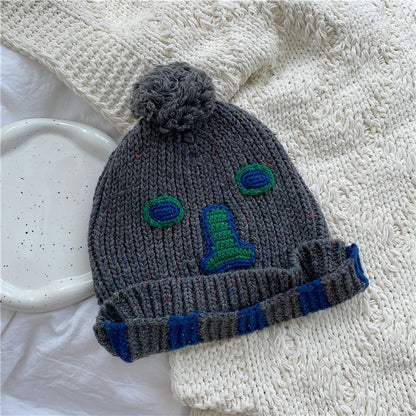 Unisex Cartoon Embroidered Pom Pom Knit Beanie — gray beanie with embroidered face and striped cuff