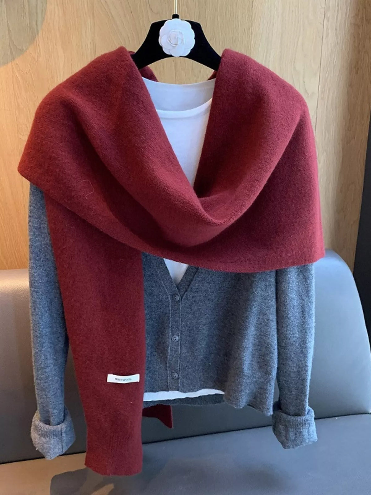 Women's Wool Knitted Asymmetrical Shawl — red asymmetrical shawl draped over a blue sweater