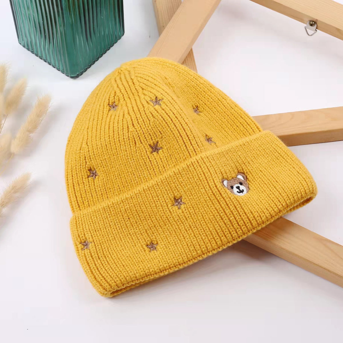 Yellow star embroidered beanie with a teddy bear face