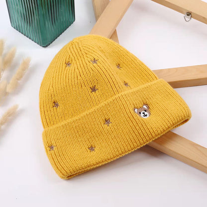 Yellow star embroidered beanie with a teddy bear face