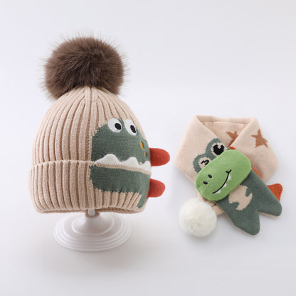 Beige dinosaur pom pom beanie and matching star-pattern scarf