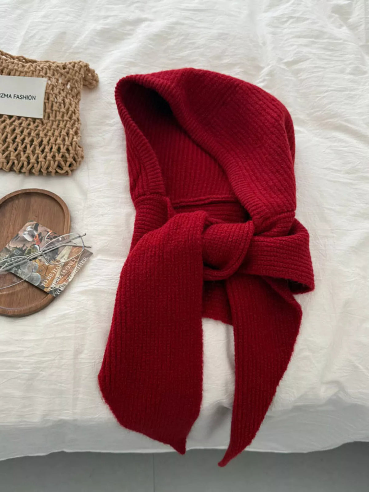 Unisex Hooded Knit Neck Scarf — red hooded accessory tied on a pale surface