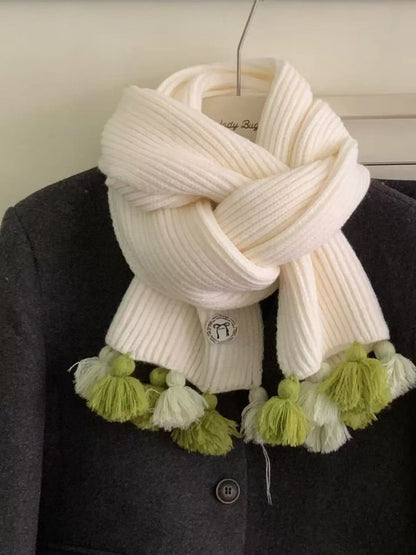 Unisex Ribbed Knit Tassel Scarf — cream scarf loosely knotted above green end details