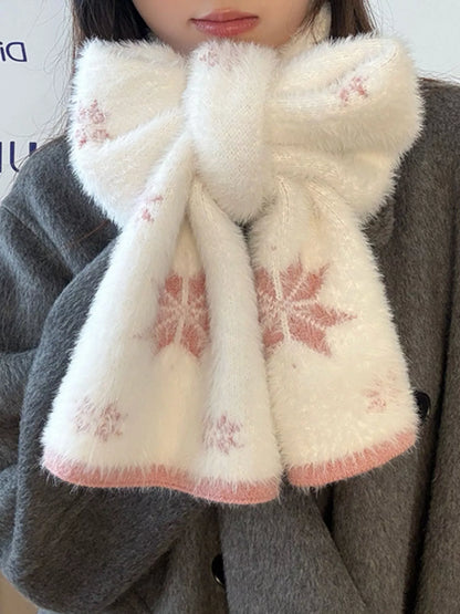 Unisex Snowflake Plush Knit Scarf — pale snowflake scarf with pink details worn at the neck