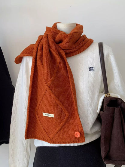 Unisex Solid Color Knitted Winter Scarf — orange knitted scarf worn with a cream top