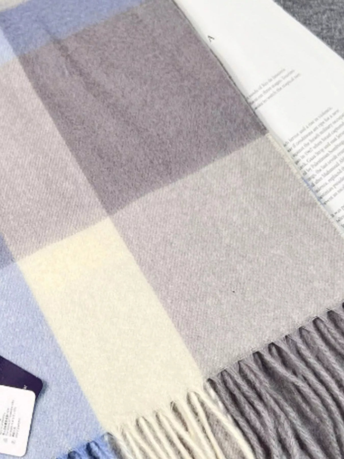 Unisex Plaid Scarf with Fringe — folded blue plaid scarf showing intersecting bands
