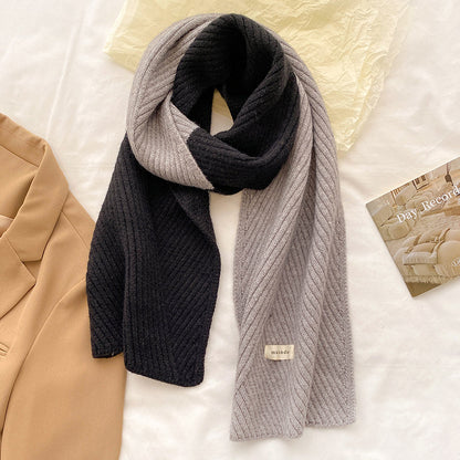 Unisex Two-Tone Ribbed Knit Winter Scarf — black and gray two-tone scarf draped over pale outerwear