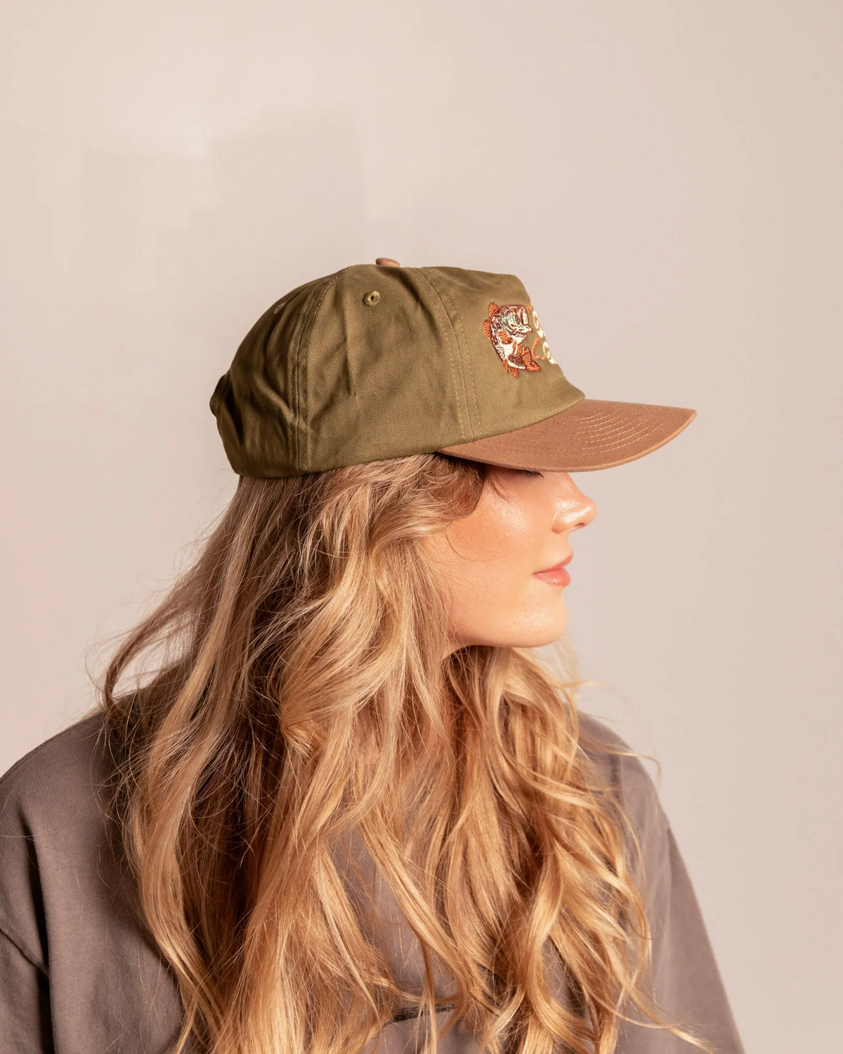 Side view of a model wearing the Steel & Saddle Bass Hat