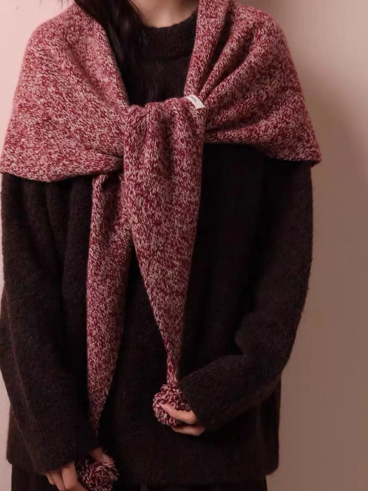 Women's Wool Pom-Pom Shawl — closer view of a tied shawl and pom-pom tips