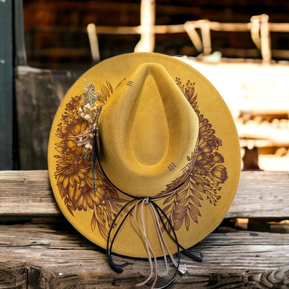 Overhead view of the Aurelia hat with floral brim artwork and decorative accents