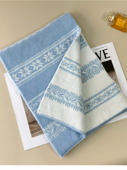 Unisex Winter Snowflake Pattern Knitted Scarf — blue and cream snowflake scarf laid diagonally