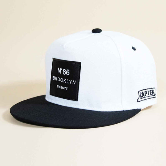 Unisex Brooklyn patch flat-brim snapback cap - white front view