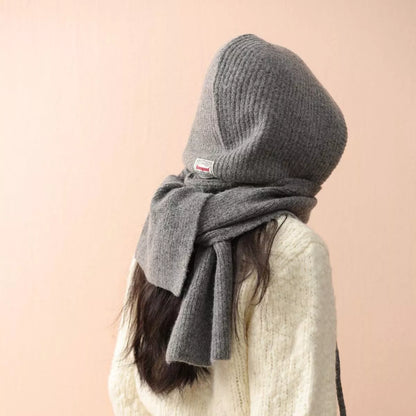 Unisex Hooded Tie Knit Scarf — side view of a gray hood scarf worn over light knitwear